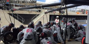 Helmet, Automotive tire, Team, Crew, Sports gear, Motorcycle, Pit stop, Race track, 