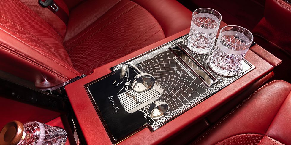Red, Luxury vehicle, Car, Vehicle, Fashion accessory, Table, 