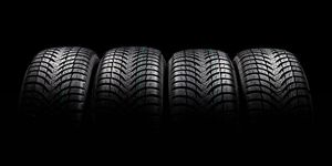 Tire, Automotive tire, Synthetic rubber, Formula one tyres, Black, Auto part, Tread, Automotive wheel system, Light, Wheel, 