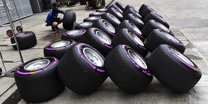 Tire, Automotive tire, Formula one tyres, Auto part, Purple, Wheel, Synthetic rubber, Automotive wheel system, Motor vehicle, Rim, 
