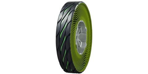 Green, Automotive tire, Rim, Circle, Silver, Synthetic rubber, Steel, Plastic, Carbon, Hubcap, 