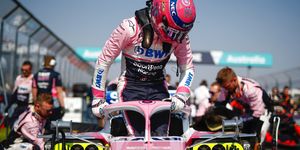 Sports uniform, Helmet, Automotive design, Sportswear, Open-wheel car, Competition event, Personal protective equipment, Racing, Sports gear, Championship, 