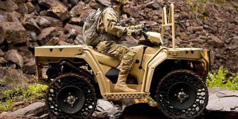 Soldier, Tire, Wheel, Military vehicle, Auto part, Camouflage, Military person, Automotive tire, Fender, Combat vehicle, 