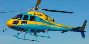 Helicopter, Rotorcraft, Mode of transport, Blue, Aircraft, Natural environment, Transport, Yellow, Helicopter rotor, Air travel, 