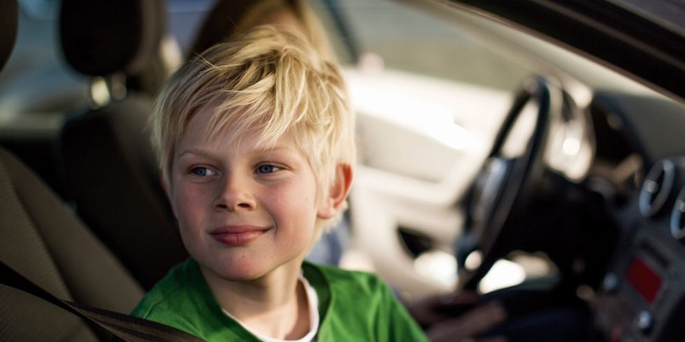 Ear, Cheek, Vehicle door, Child, Automotive mirror, Steering wheel, Cool, Car seat, Steering part, Blond, 