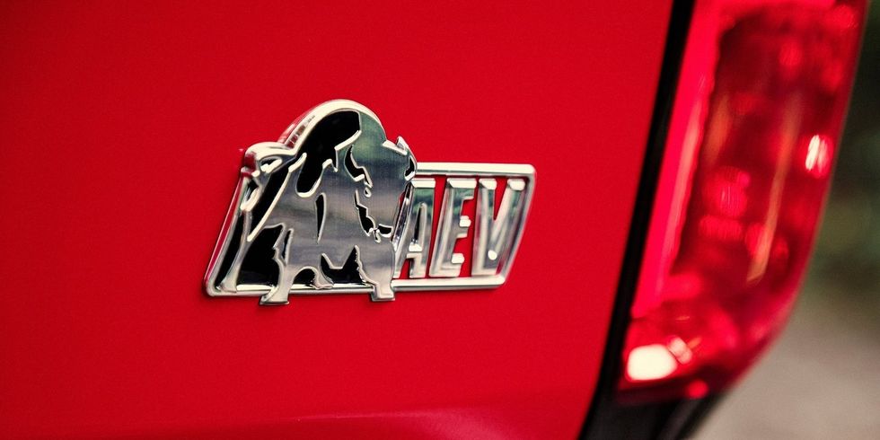 Vehicle, Car, Red, Automotive lighting, Automotive tail & brake light, Emblem, Family car, Logo, Trunk, 