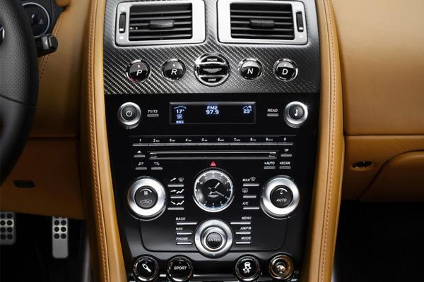 Brown, Vehicle audio, Center console, Electronic device, Technology, Electronics, Gear shift, Machine, Luxury vehicle, Steering part, 