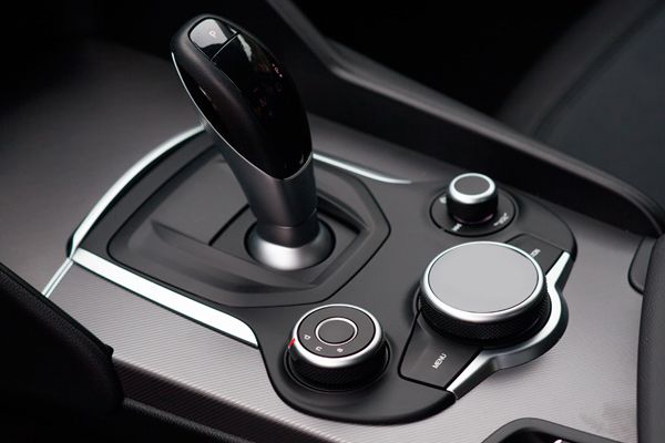 Automotive design, Gear shift, Luxury vehicle, Carbon, Personal luxury car, Steering part, Silver, Center console, 