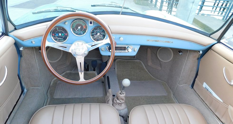 Land vehicle, Vehicle, Car, Motor vehicle, Steering wheel, Center console, Classic car, Steering part, Classic, Coupé, 
