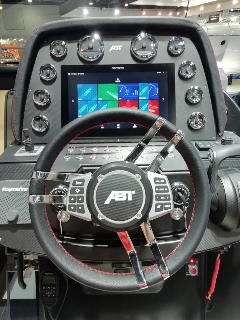 Vehicle, Steering wheel, Steering part, Auto part, Technology, Electronics, Speedboat, Boat, Electronic device, Cockpit, 