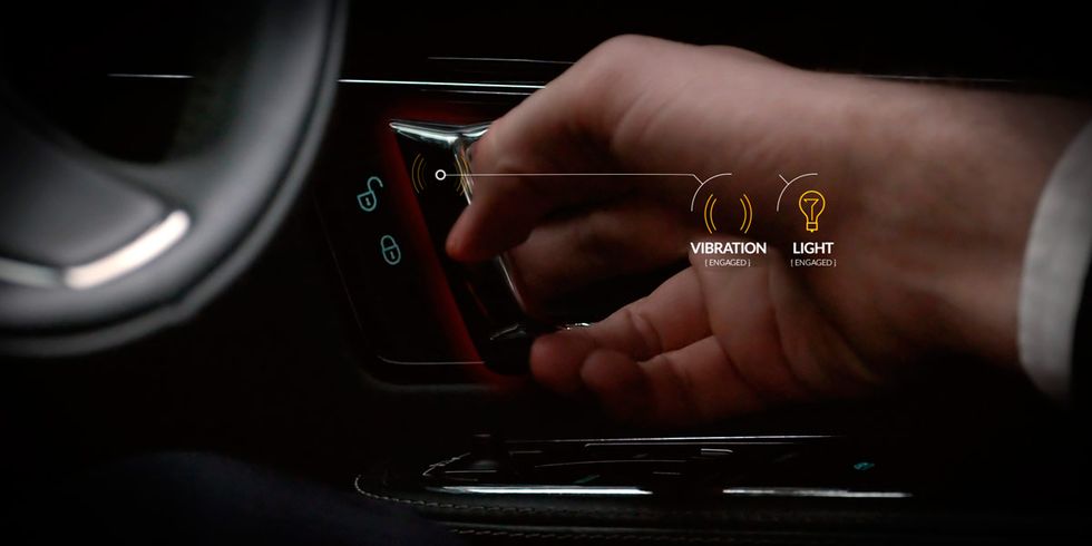 Finger, Hand, Wrist, Nail, Thumb, Center console, Steering part, Luxury vehicle, Vehicle door, Steering wheel, 