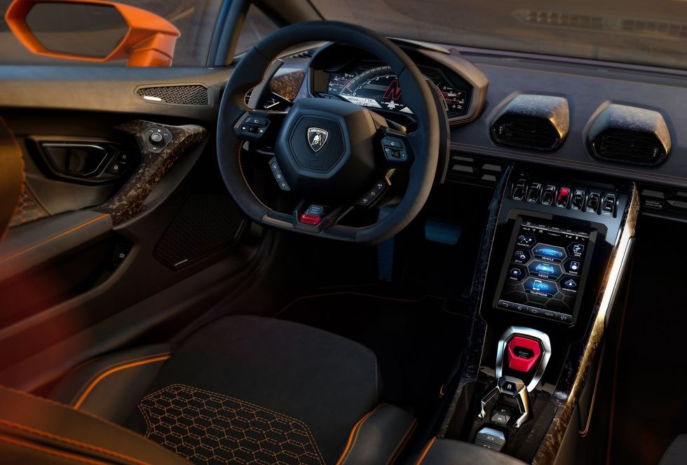 Land vehicle, Vehicle, Car, Center console, Steering wheel, Gear shift, Personal luxury car, Automotive design, Steering part, Supercar, 