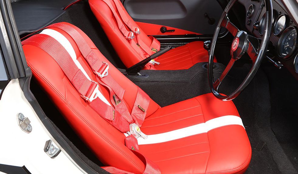 Land vehicle, Vehicle, Car, Red, Seat belt, Car seat, Car seat cover, Steering wheel, Center console, 