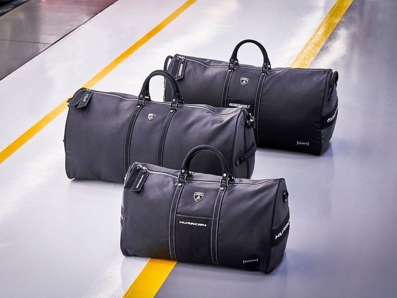 Bag, Handbag, Baggage, Leather, Luggage and bags, Fashion accessory, Duffel bag, Hand luggage, Material property, Brand, 