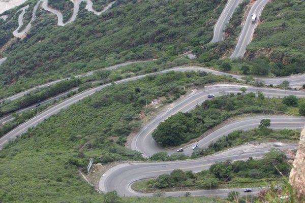 Vegetation, Road, Landscape, Highland, Thoroughfare, Groundcover, Plantation, Geological phenomenon, Mountain pass, Highway, 