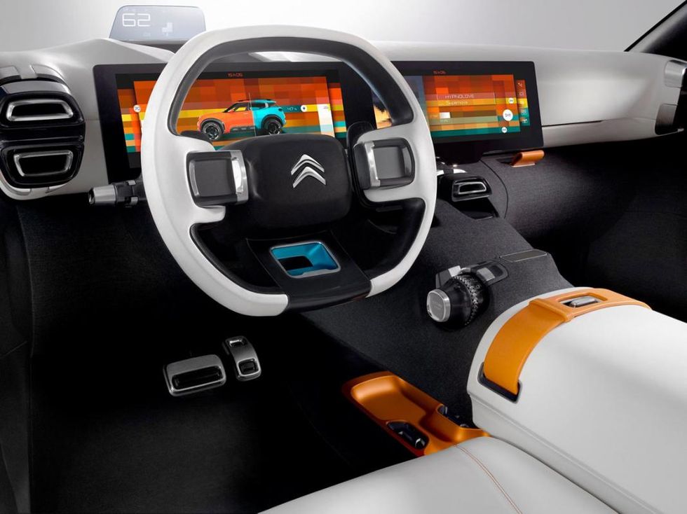 Motor vehicle, Automotive design, Orange, Steering part, Vehicle audio, Steering wheel, Technology, Center console, Luxury vehicle, Auto part, 