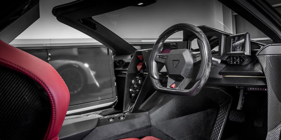 Land vehicle, Vehicle, Car, Steering wheel, Steering part, Automotive design, Center console, Performance car, Personal luxury car, Supercar, 