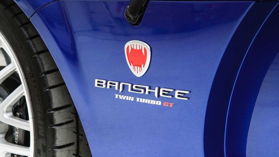 Vehicle, Car, Electric blue, Logo, Tire, Automotive design, Wheel, Emblem, 