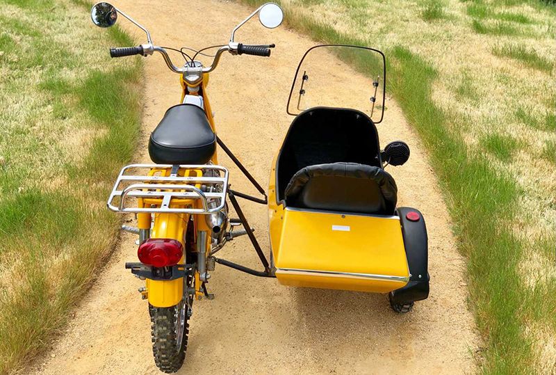 Land vehicle, Vehicle, Motor vehicle, Motorcycle, Mode of transport, Yellow, Grass, Tricycle, Car, Automotive wheel system, 