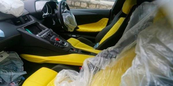 Motor vehicle, Mode of transport, Yellow, Transport, Vehicle door, Car seat, Car seat cover, Steering wheel, Steering part, Automotive mirror, 