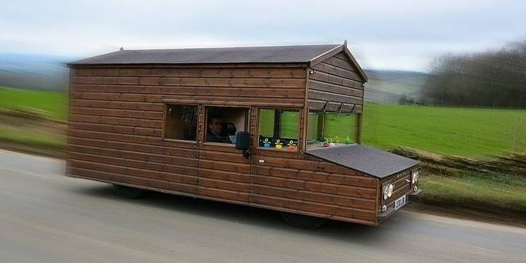 Wood, Brown, Transport, Property, Roof, Land lot, Composite material, Mobile home, Shade, Outdoor structure, 