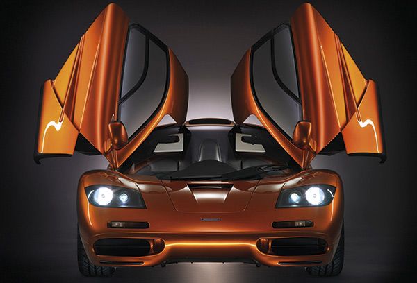Automotive design, Automotive lighting, Orange, Headlamp, Hood, Automotive exterior, Amber, Bumper, Light, Automotive mirror, 