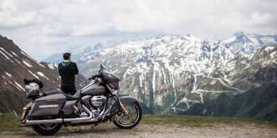 Motorcycle, Tire, Mountainous landforms, Mountain range, Fender, Automotive tire, Mountain, Travel, Motorcycle accessories, Fuel tank, 