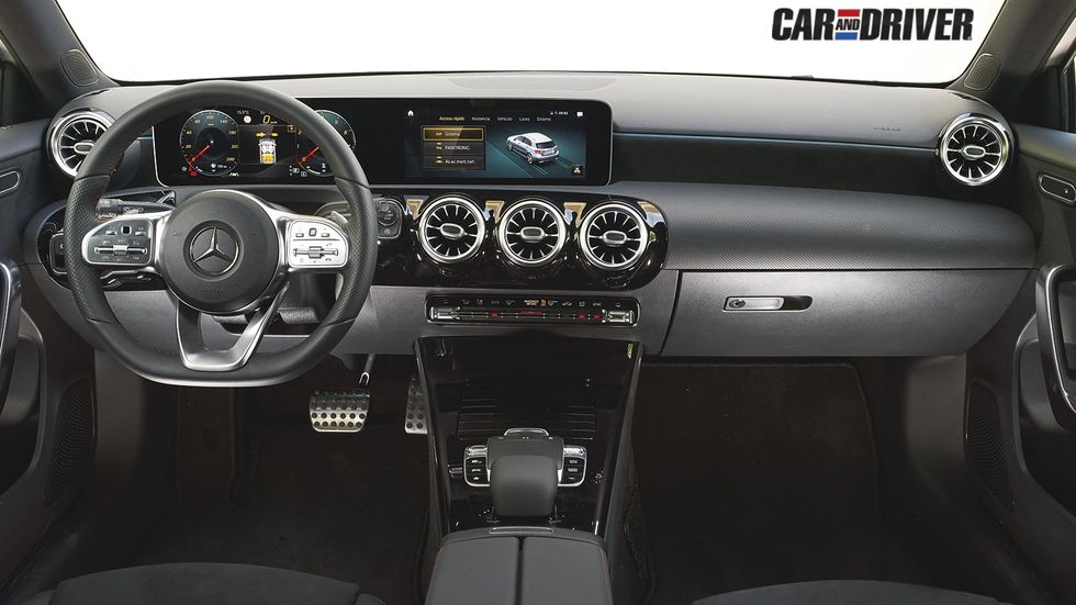 Vehicle, Car, Steering wheel, Center console, Motor vehicle, Speedometer, Luxury vehicle, Gauge, Compact car, Vehicle audio, 