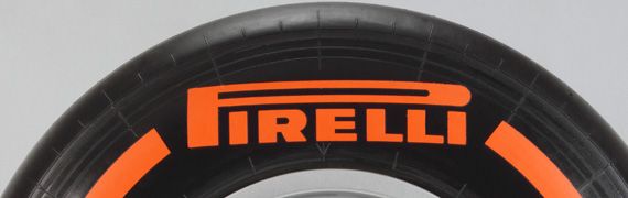 Orange, Automotive tire, Amber, Font, Black, Grey, Rim, Synthetic rubber, Circle, Tire care, 