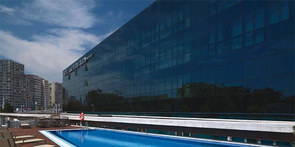 Swimming pool, Blue, Azure, Aqua, Rectangle, Composite material, Outdoor furniture, Apartment, Commercial building, Bench, 