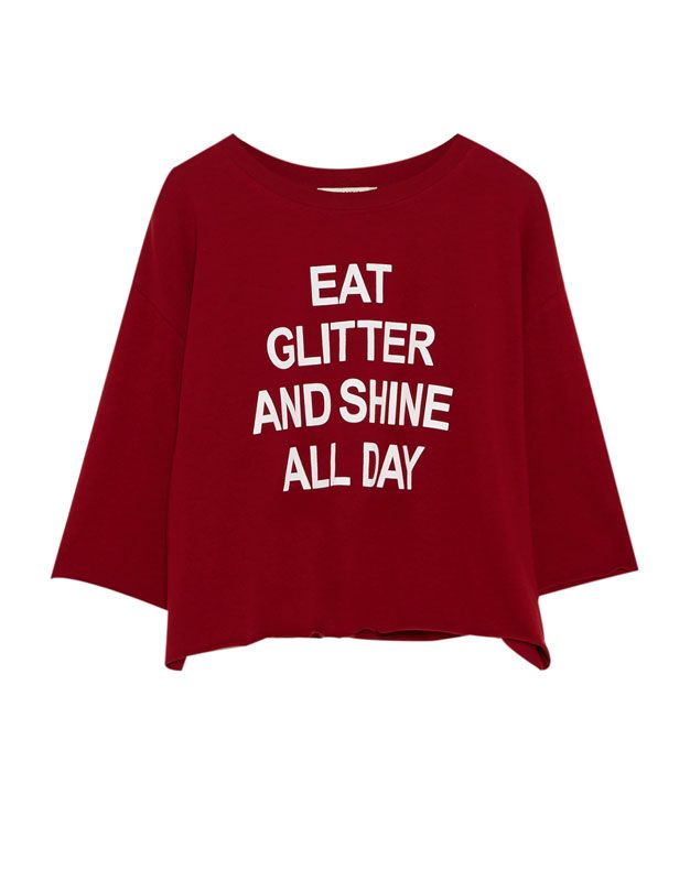 Clothing, Red, T-shirt, Sleeve, Product, Text, Crop top, Font, Outerwear, Top, 