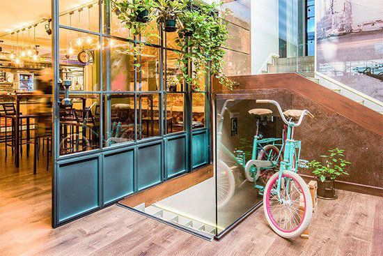 Bicycle wheel, Bicycle, Vehicle, Architecture, Building, Room, Window, Interior design, Bicycle part, Door, 