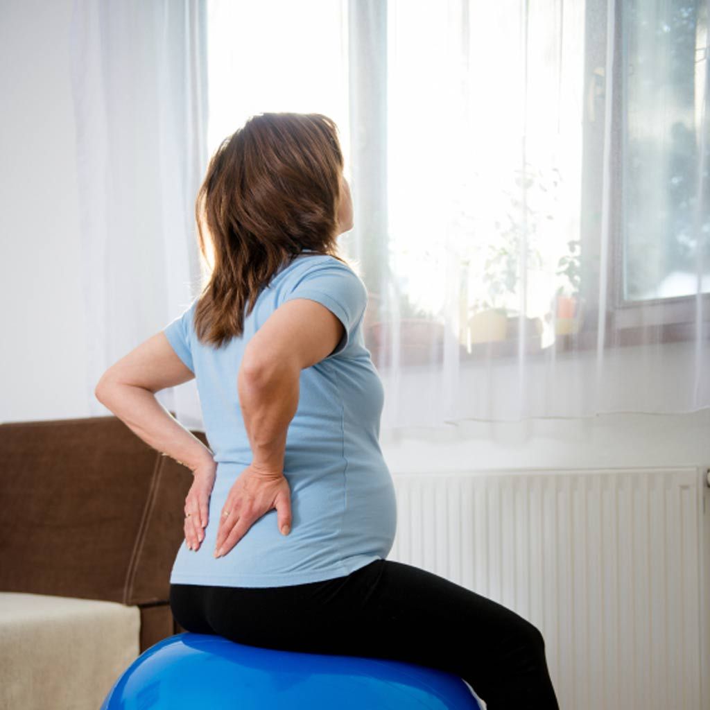 Swiss ball, Shoulder, Physical fitness, Ball, Sitting, Joint, Active pants, Leg, Arm, yoga pant, 