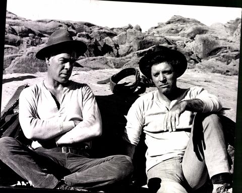 Sitting, Hat, Rock, Sun hat, Bedrock, Monochrome, Outcrop, Fedora, Lap, Boulder, 