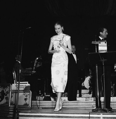 Stairs, Dress, Microphone, Stage, Performance, Microphone stand, Monochrome, One-piece garment, Monochrome photography, Day dress, 