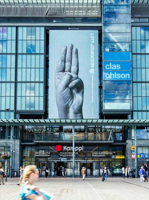 Finger, Commercial building, Metropolitan area, Pedestrian, Street fashion, Advertising, Display device, Mixed-use, Sidewalk, Signage, 