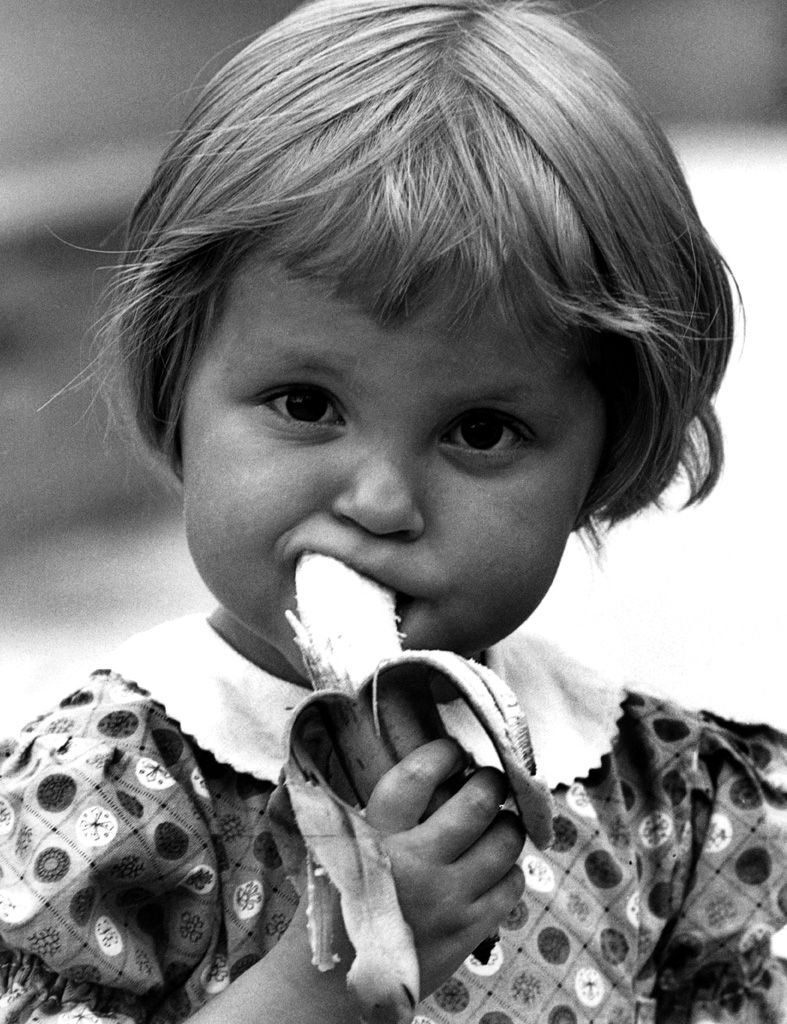 Face, Lip, Child, Iris, Toddler, Eating, Baby & toddler clothing, Fruit, Taste, Monochrome photography, 