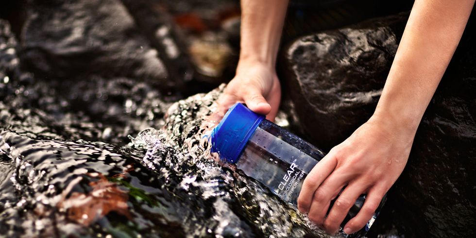 Fluid, Wrist, Liquid, Water bottle, Nail, Electric blue, Bottle, Colorfulness, Plastic bottle, Cobalt blue, 