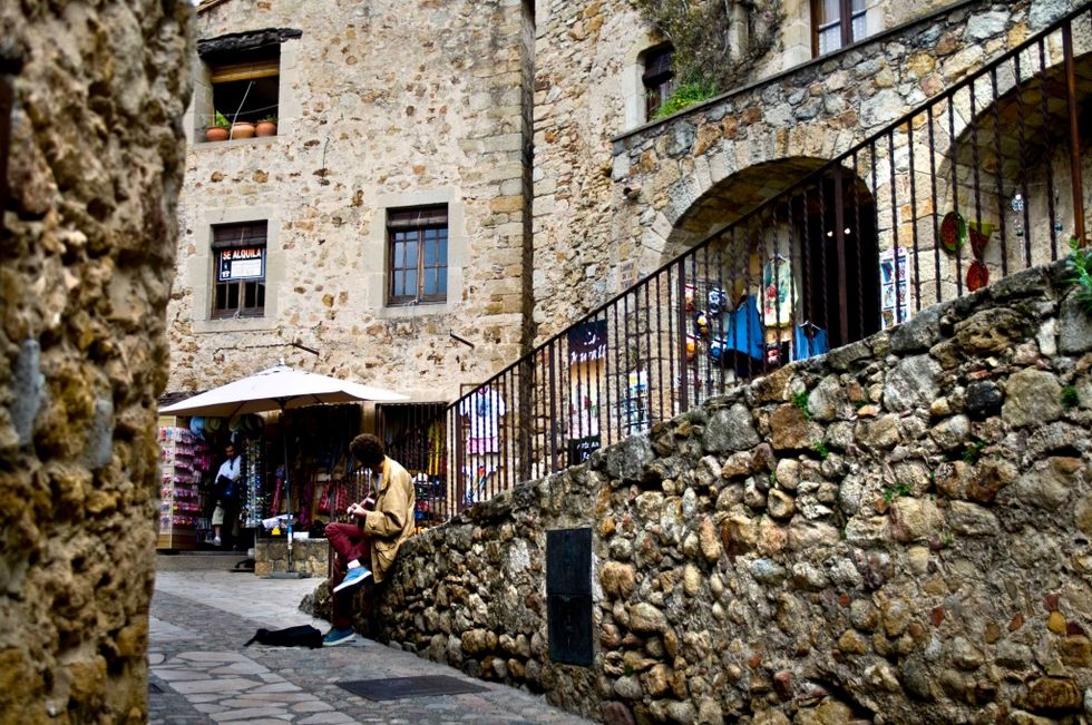 Wall, Town, Tourism, Stone wall, Flooring, Street, Cobblestone, Travel, Arch, Medieval architecture, 