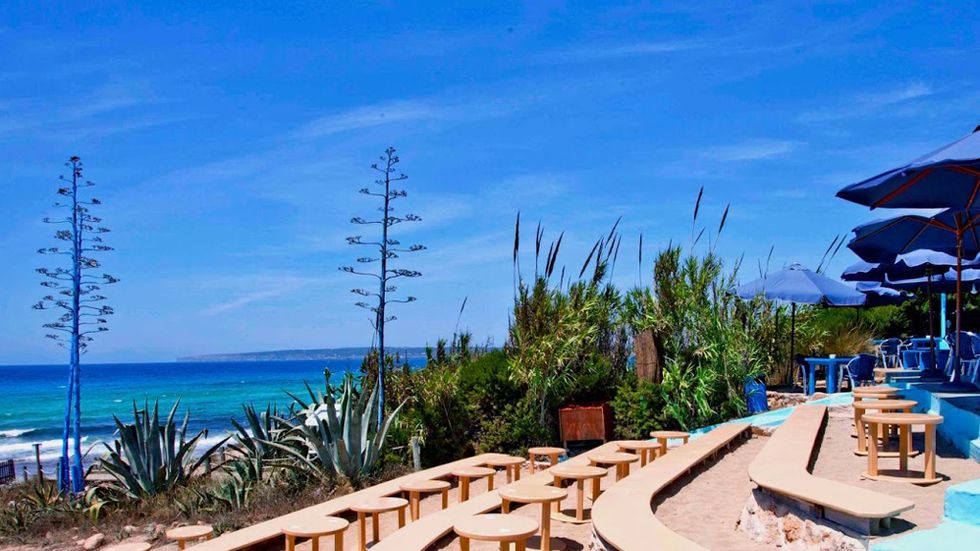 Resort, Coastal and oceanic landforms, Outdoor furniture, Ocean, Azure, Swimming pool, Seaside resort, Shade, Tropics, Aqua, 