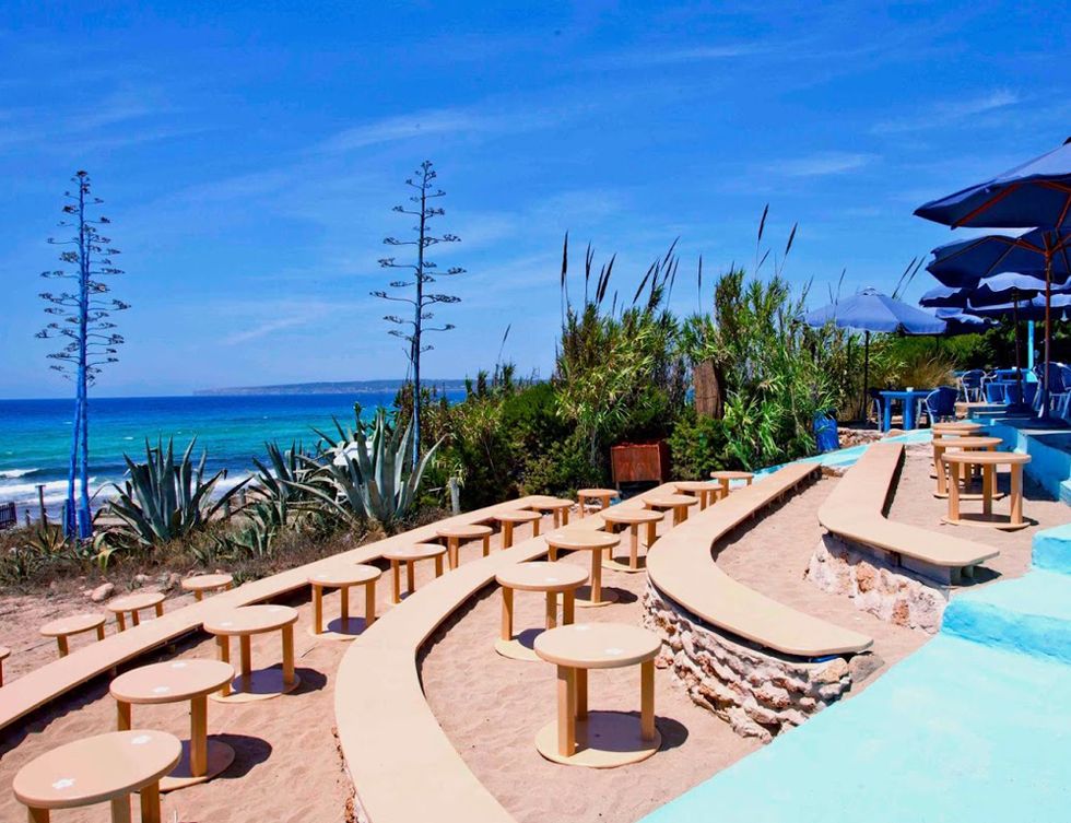 Resort, Coastal and oceanic landforms, Outdoor furniture, Ocean, Azure, Swimming pool, Seaside resort, Shade, Tropics, Aqua, 