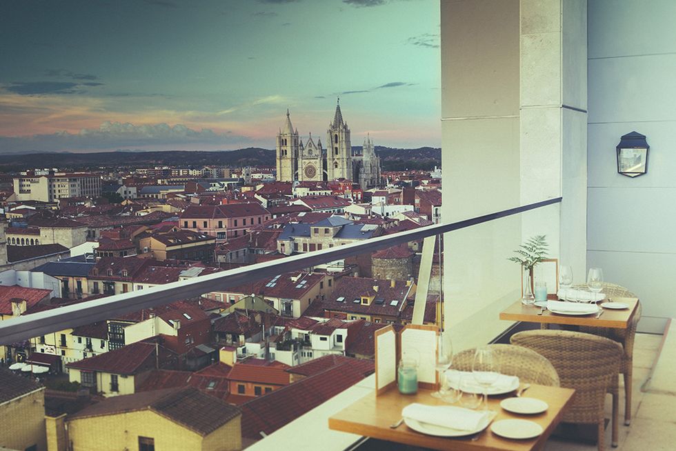 Table, Furniture, Roof, Urban area, Dishware, Tower, Kitchen & dining room table, Cityscape, Spire, Steeple, 