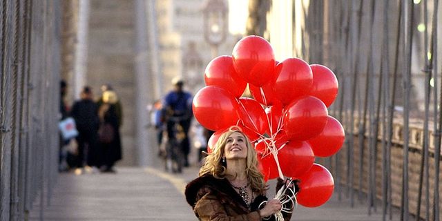 Balloon, Infrastructure, Standing, Coat, Party supply, Street, Street fashion, Fashion, Dress, Bag, 