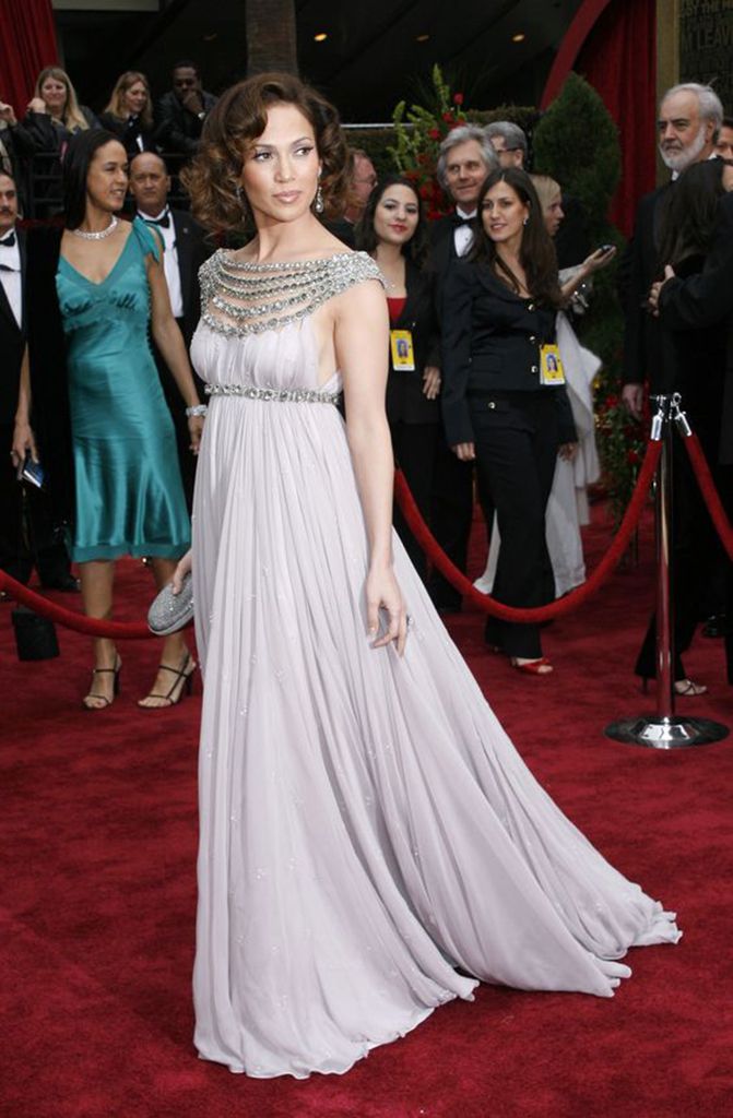 Red carpet, Gown, Dress, Carpet, Clothing, Flooring, Shoulder, Premiere, Event, Fashion, 