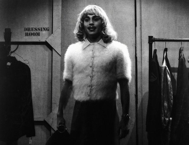 Standing, Monochrome, Chest, Clothes hanger, Fur, Waist, Animal product, Abdomen, Natural material, Fur clothing, 