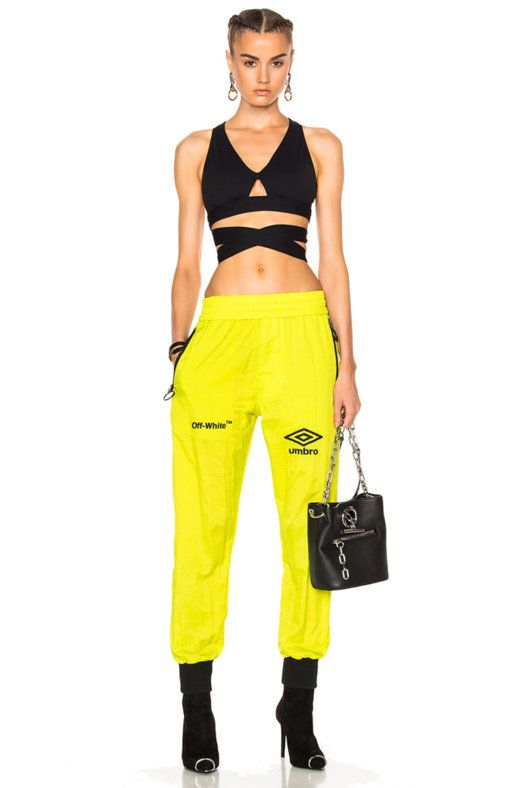 Clothing, Sportswear, Yellow, sweatpant, Standing, Crop top, Trousers, Sports bra, Waist, Active pants, 