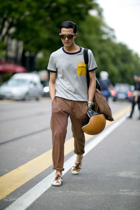 Trousers, Ball, Road, Sunglasses, Human leg, Goggles, T-shirt, Road surface, Asphalt, Street fashion, 