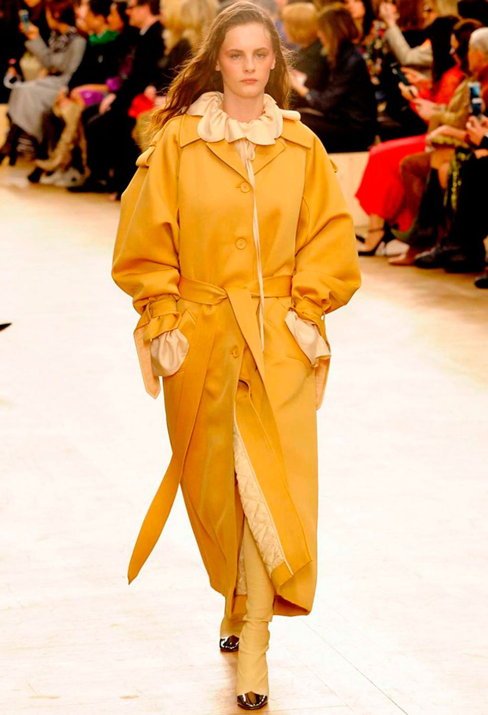 Fashion model, Fashion, Fashion show, Runway, Clothing, Yellow, Outerwear, Event, Public event, Haute couture, 