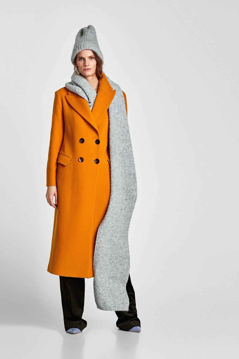Clothing, Overcoat, Coat, Outerwear, Trench coat, Orange, Standing, Hood, Duster, Sleeve, 