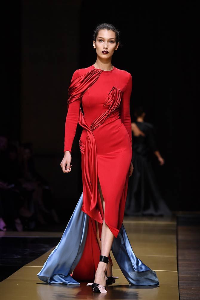 Clothing, Shoulder, Fashion show, Shoe, Joint, Red, Fashion model, Formal wear, Style, Dress, 